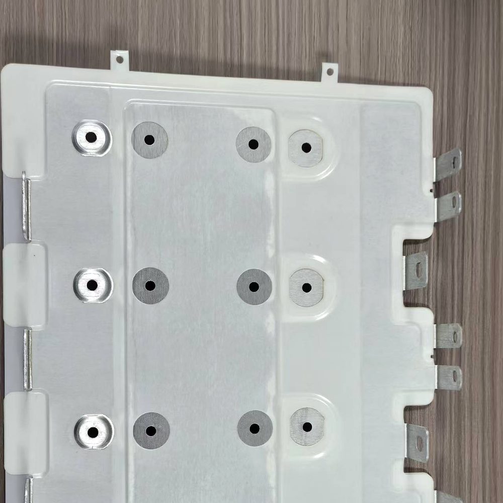 Laminated busbar for power electronics with side-mounted tab terminals